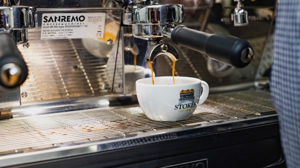 Stokes coffee being poured from espresso machine in Boston coffee shop
